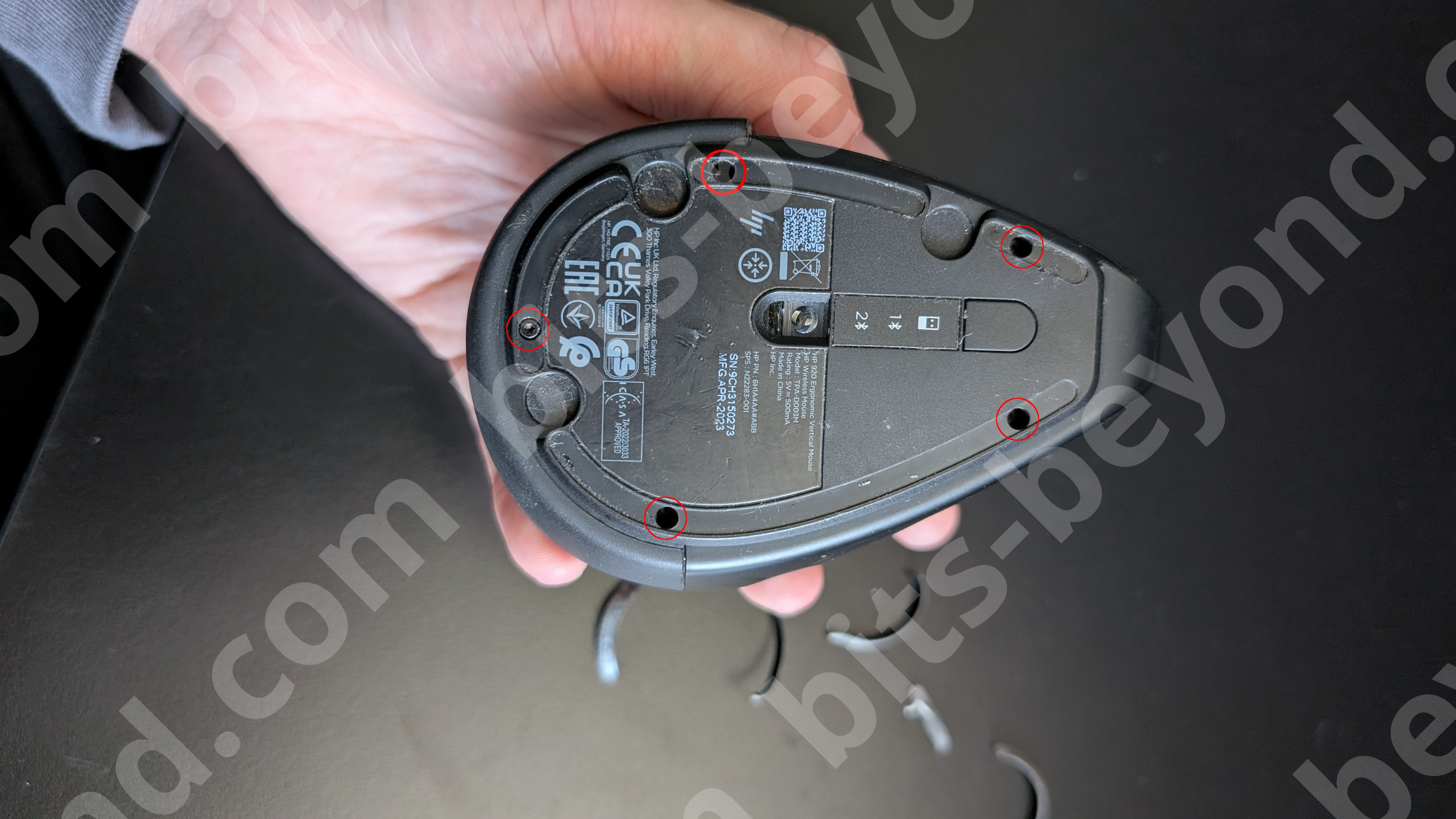 Image showing 4 screws on the bottom of the mouse